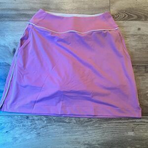 Puma pink tennis skirt with built in shorts. Size: XS